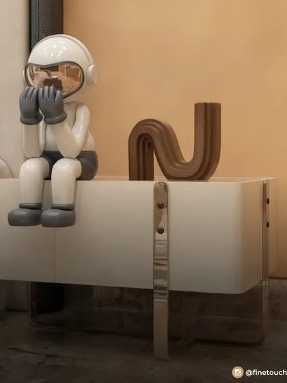 We love adding fun details like this astronaut figurine on the bedside table. These small, thematic touches are what make a child's room feel personal and special.