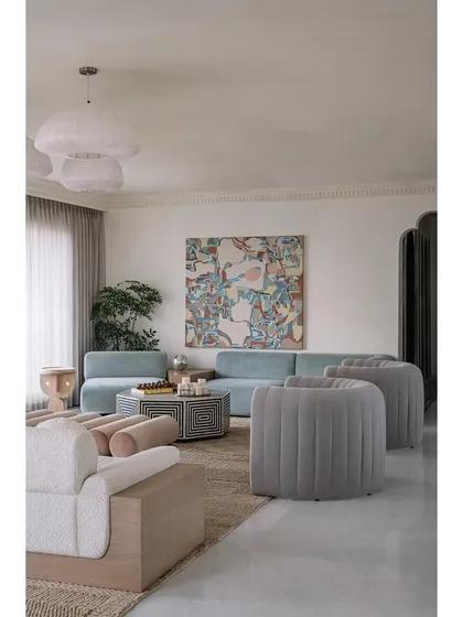 Each piece in the Eden House living room feels special, from the face-designed side tables to the custom gradient bar. It's a collected, eclectic space that reflects the homeowners' personalities.