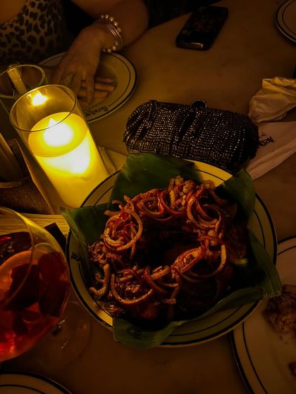 A candlelight dinner with friends. Good food and good company are the perfect combination.