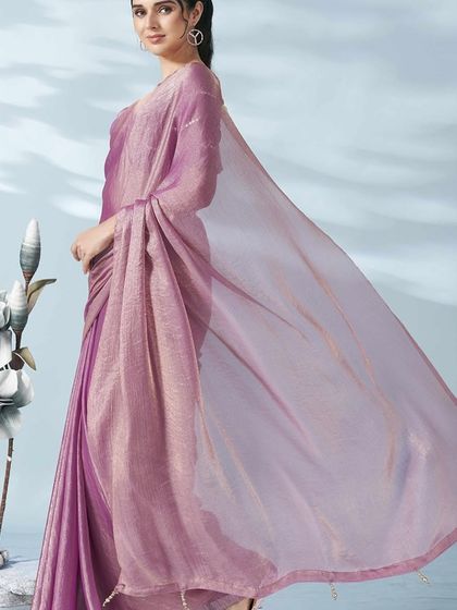 A side view of the lilac tissue saree, capturing the beautiful movement and translucency of the fabric.