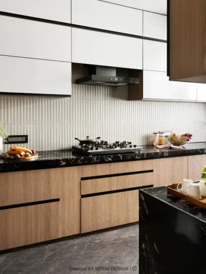 A dream kitchen isn't just about looks, it's about making life easier. This design features a combination of wood-finish and white cabinets with black hardware for a clean, modern aesthetic.