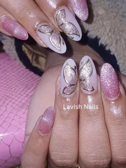 A delicate design with pink cat-eye glitter nails and accent nails featuring a beautiful, shimmering hand-painted butterfly.