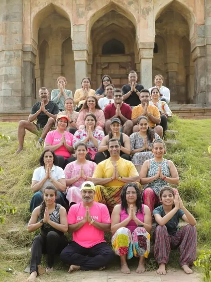 Our group in a moment of gratitude after our International Day of Yoga session at a historic Lodhi Garden tomb.