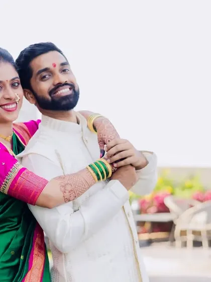 A fun and joyful pose from Asawari and Amit's engagement shoot. The bride's hug from behind shows their playful and affectionate bond.