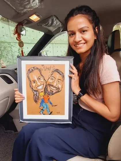 Look at that happy smile! A client holding her custom couple caricature, a special gift that perfectly captured her and her partner's bond.