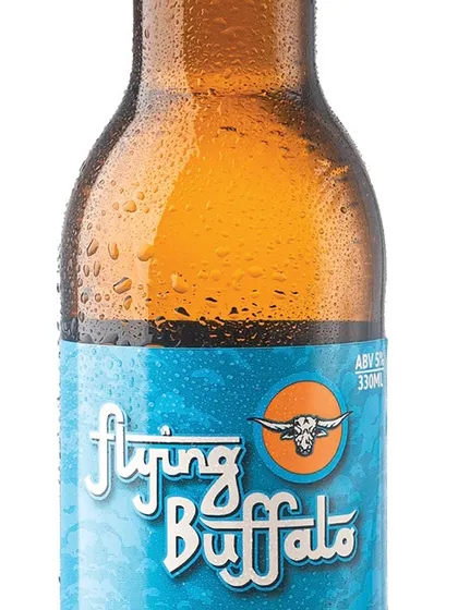 A detailed close-up is essential for showing product quality. This shot highlights the brand logo, the texture of the label, and the cold condensation on the bottle, all key details for a discerning customer.