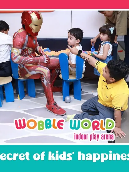The secret to kids' happiness? A party with their favorite superhero! Iron Man makes a special appearance to interact with the children.