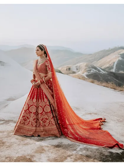 A breathtaking bridal portrait set against a vast, minimalist mountain landscape. This shot highlights our expertise in destination wedding photography, creating epic, magazine-worthy images for our brides.