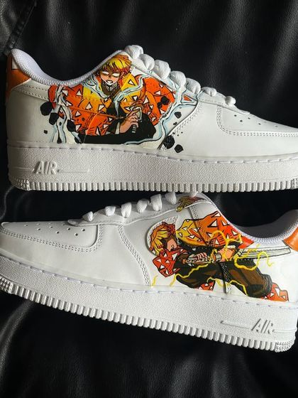 The full pair of Zenitsu-themed Demon Slayer custom sneakers, showcasing the action poses on both shoes.