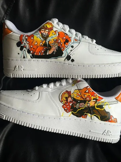 The full pair of Zenitsu-themed Demon Slayer custom sneakers, showcasing the action poses on both shoes.
