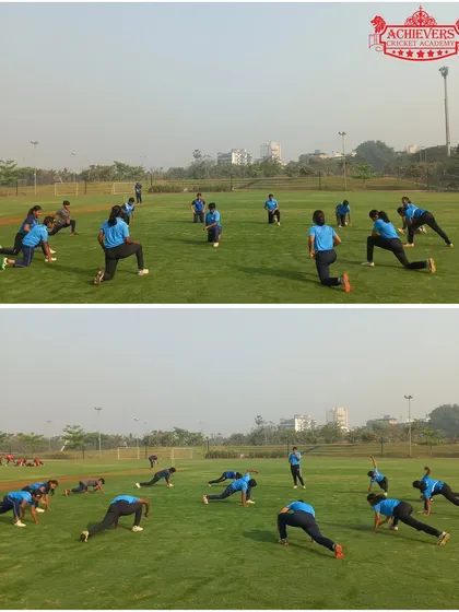 The girls' team warming up with stretching and fitness drills, preparing their bodies for the match ahead.