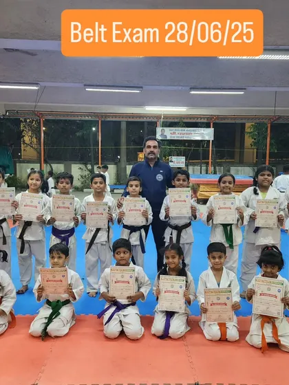The next generation of martial artists. My youngest students proudly display their certificates after a successful belt exam, marking an important step in their karate journey.