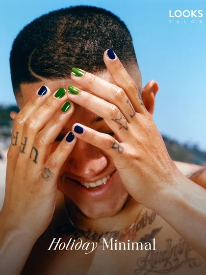 Grooming goes beyond just hair and beards. This image showcases a modern approach to men's manicures with bold, minimalist nail art. It's a form of self-expression that proves attention to detail is everything.