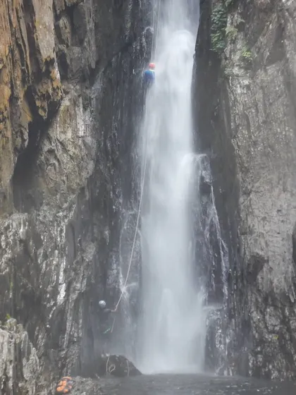 A full view of the rappel down one of the main drops in Knotty Canyon. The force of the water is immense, which is why proper technique is critical.