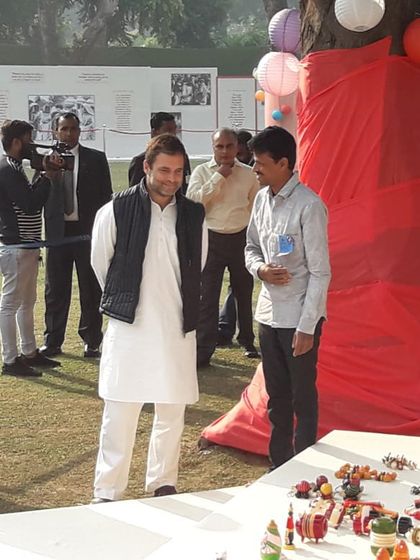 Discussing the intricacies of our craft with Mr. Rahul Gandhi. In the background, you can see former Prime Minister Dr. Manmohan Singh and Mrs. Sonia Gandhi observing our collection of handmade toys.