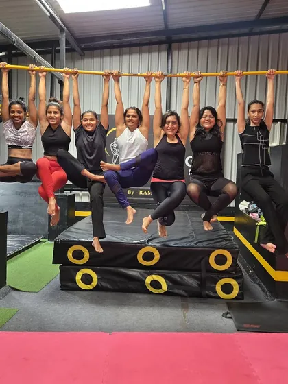 Our adult classes are more than just training; they're about building a community of strong, supportive women. We work on everything from bar hangs for grip strength to advanced acrobatic skills together.