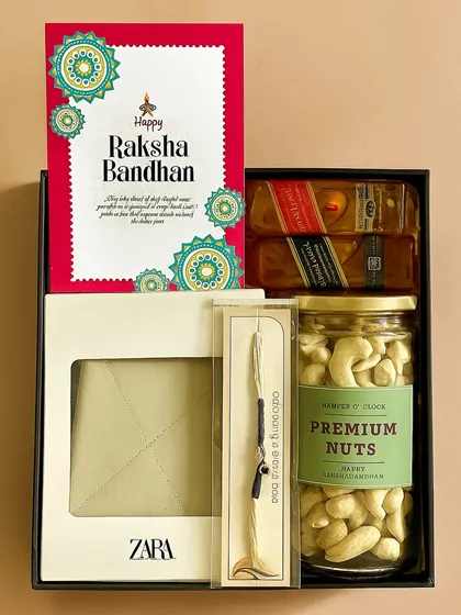 We love creating gifts that celebrate relationships. This Raksha Bandhan hamper for a brother includes a stylish Zara wallet, premium nuts, and Johnnie Walker miniatures, all presented in a sleek black box with a heartfelt, custom Rakhi card.
