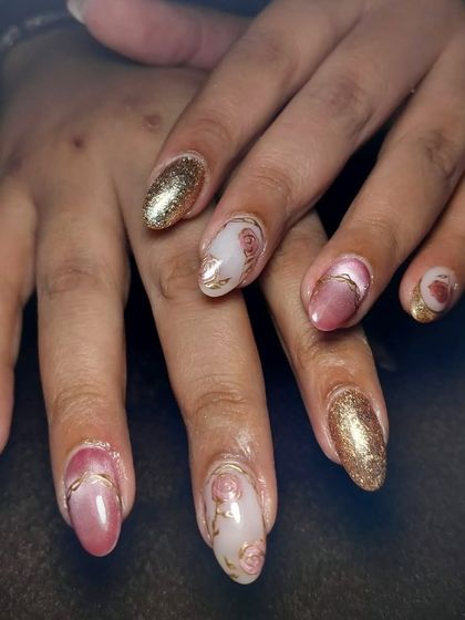 Rose-tinted perfection. This elegant design combines a soft pink cat-eye effect with delicate, hand-painted roses and gold line art for a truly divine look.