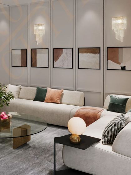Modern minimalism meets luxurious comfort in this living room. The long, curving sofa provides ample seating, while the abstract art and layered lighting create a sophisticated and inviting atmosphere.