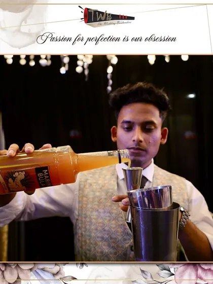 A bartender measures ingredients for a signature cocktail, emphasizing our commitment to consistency and quality.