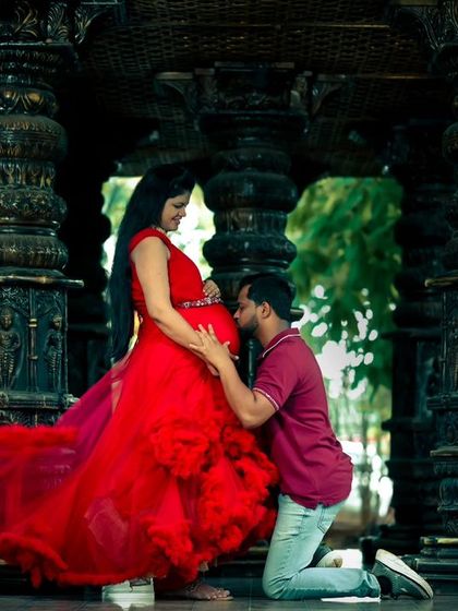A beautiful maternity shot at our stone pillar hall, with the red dress creating a stunning contrast.