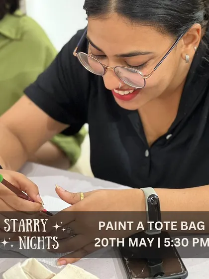A happy artist at work during our Starry Nights tote bag painting event. There's nothing better than seeing someone completely absorbed and joyful in their creative process.