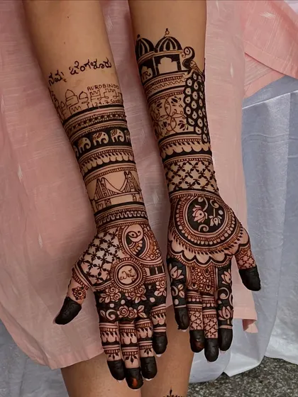 Your story, your mehendi. For this bride, I incorporated iconic Bangalore landmarks and Kannada script, making her bridal henna a unique tribute to her roots and her city.