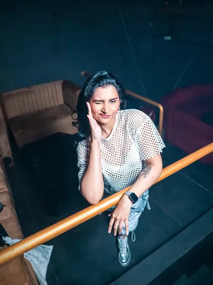 A candid shot from a pre-gig photoshoot. Just taking a moment to relax before the energy of the night begins.
