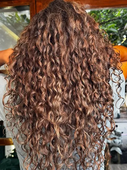 You don't have to cover your greys, you can blend them beautifully. This is a perfect example of how we use subtle coloring techniques to work with your natural grey hair, creating a stunning, multi-dimensional look.