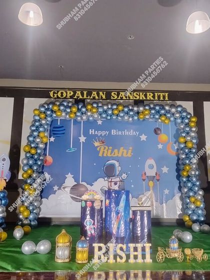 An outer space adventure theme with an astronaut, rockets, and a planet-filled backdrop.