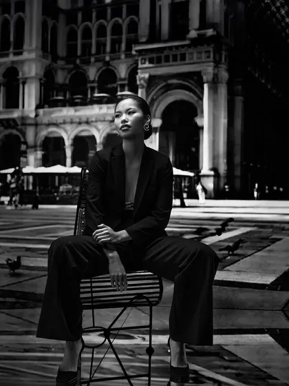 A black and white take on projection photography. The high-contrast European plaza backdrop adds a sense of drama and scale, a technique we cover for creating powerful editorial images.