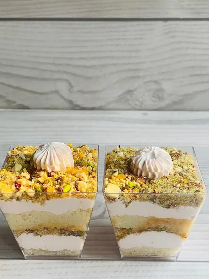 My Rose Chikki Dessert Cup is another Makar Sankranti special. It fuses crisp, nutty rose chikki with a vanilla cake and fragrant rose cream in a decadent layered cup.