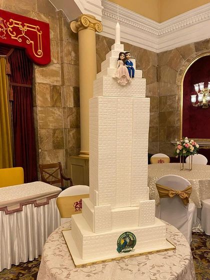 A different perspective of the impressive Empire State Building wedding cake, capturing its height and detail.
