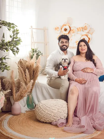 A perfect family portrait in our cozy, boho-themed setup. We absolutely love it when you bring your fur babies along; after all, they are part of the family too.