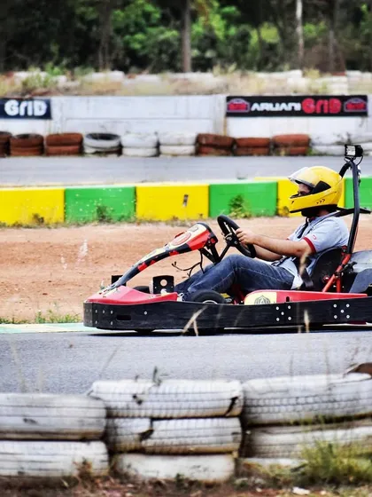 A lone driver takes on one of the 14 challenging turns. Our track is designed to be enjoyable for beginners but testing for experts.