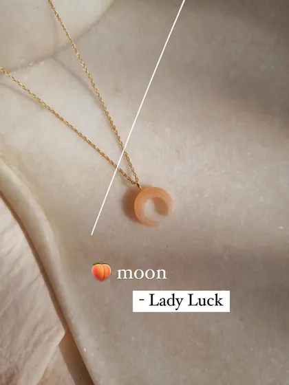 This is my peach moonstone crescent pendant, which I call 'avah'. It's known as a traveler's stone and a stone of new beginnings, bringing inspiration to those who wear it.