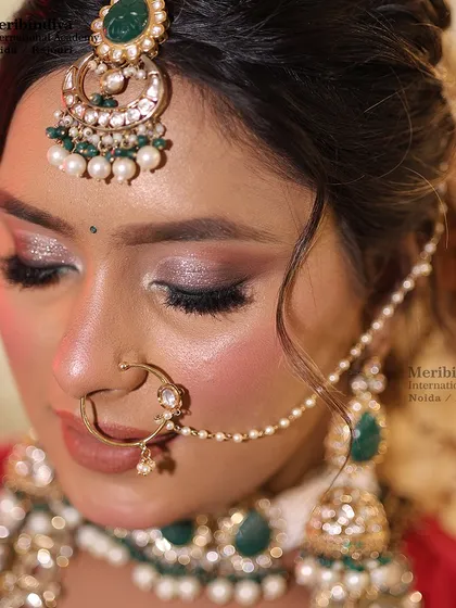 A detailed shot of the shimmering eye makeup. My course covers various eye makeup techniques, including cut-crease, halo eyes, and glitter application.