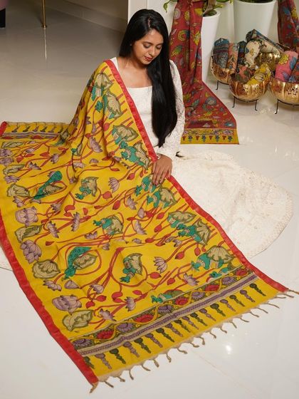 This is a glimpse into my Kalamkari Edition, featuring a wide array of hand-painted dupattas and fabrics from the Indralokam series. Each piece is a unique story, available for you to customize into your dream outfit.