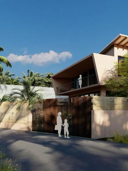 The street view of the Corgao Villa, showcasing its contemporary form and use of natural materials that blend with the Goan landscape.