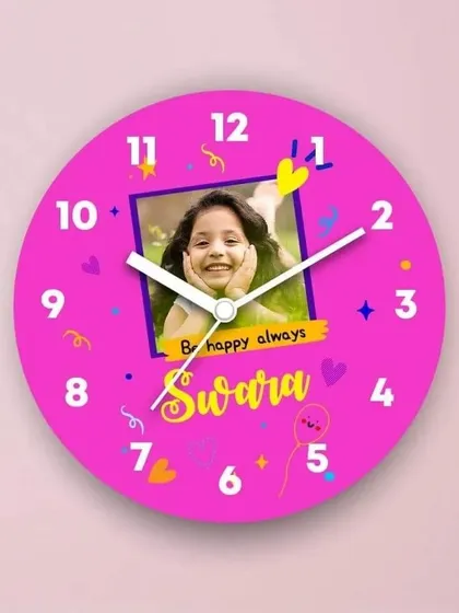 Brighten up a kid's room with this personalized wall clock. This 8x8 inch clock features a photo, name, and a vibrant pink design.
