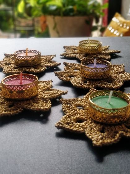My golden tea light holders set up on a balcony table, creating a perfect ambiance for a quiet evening.