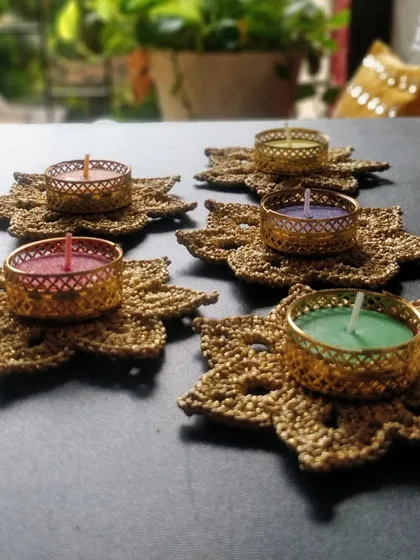 My golden tea light holders set up on a balcony table, creating a perfect ambiance for a quiet evening.