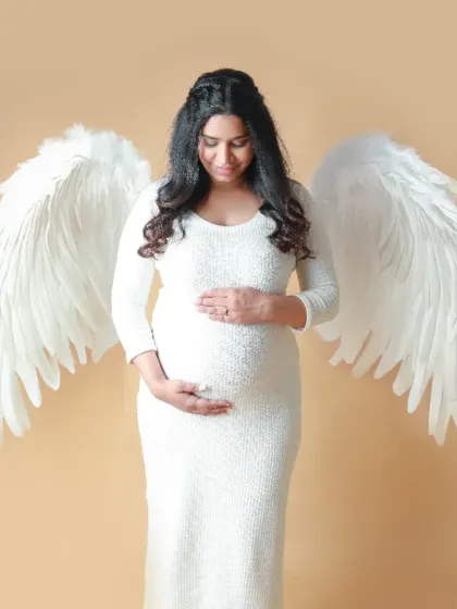 Every mother is an angel watching over her child. In my studio, I have props like these beautiful angel wings to create ethereal, dreamy portraits that symbolize the protective and pure love of a mother.