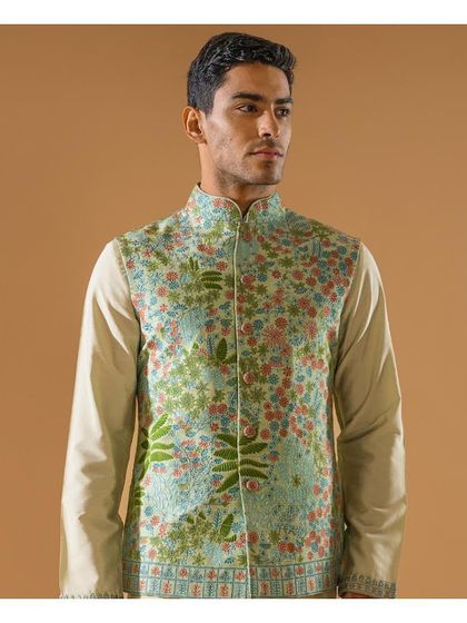 A closer look at the pastel green embroidered Jawahar jacket, showing the artistry and detail of the floral patterns. A truly elegant piece for any festive gathering.