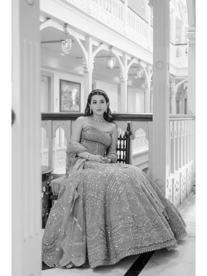 A beautiful black and white portrait of the bride, Noor, in the corridors of the Taj Falaknuma Palace. Her elegance and the grandeur of the location create a timeless and regal image.