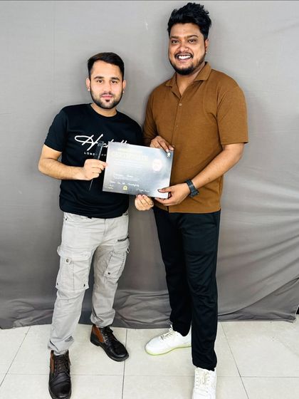 My student Manjeet, who is now a talented hairstylist himself, receiving his certificate.
