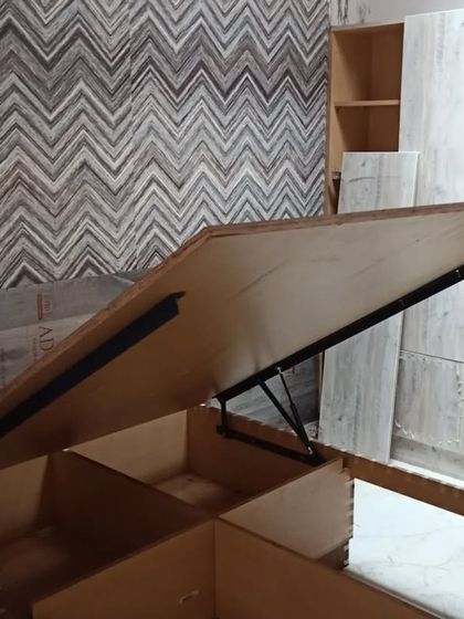 A look at the interior work happening on a Sunday at an outstation project. This image shows a bed with hydraulic lift storage, a practical solution for maximizing space.