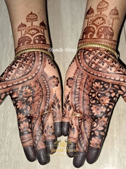 The beautiful dark stain of a traditional design, showing how the 'meenakari' style creates a wonderful contrast even after the paste is off.