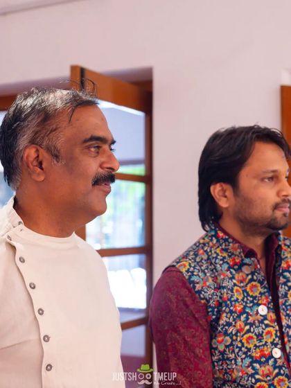 Candid moments from the art exhibition, observing the collection with fellow artists.