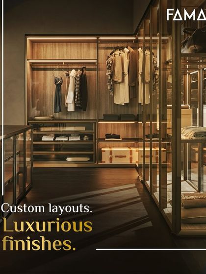 Custom layouts and luxurious finishes are the cornerstones of our work. This walk-in closet uses a combination of open shelving and glass-fronted drawers to create a visually dynamic and highly functional storage system.